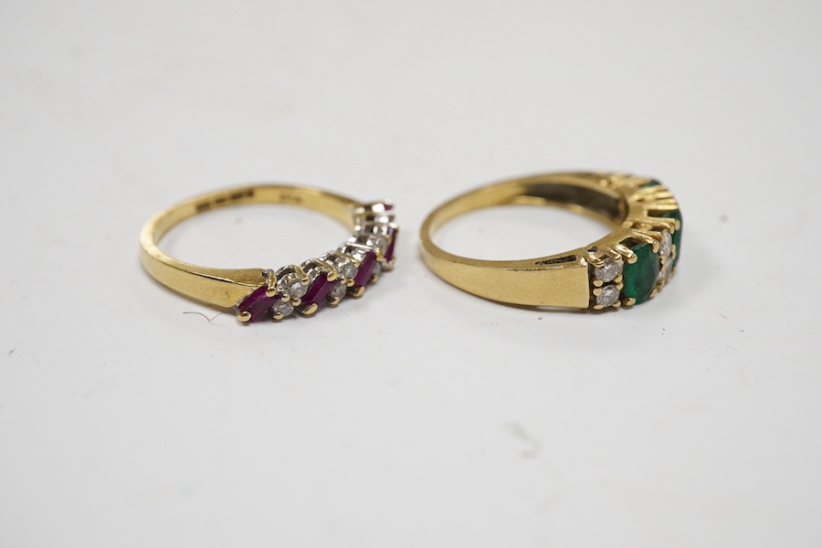 A modern 18ct gold, ruby and diamond set half hoop ring, size M and a yellow metal emerald and diamond set half hoop ring, size L/M, gross weight 6 grams. Condition - poor to fair